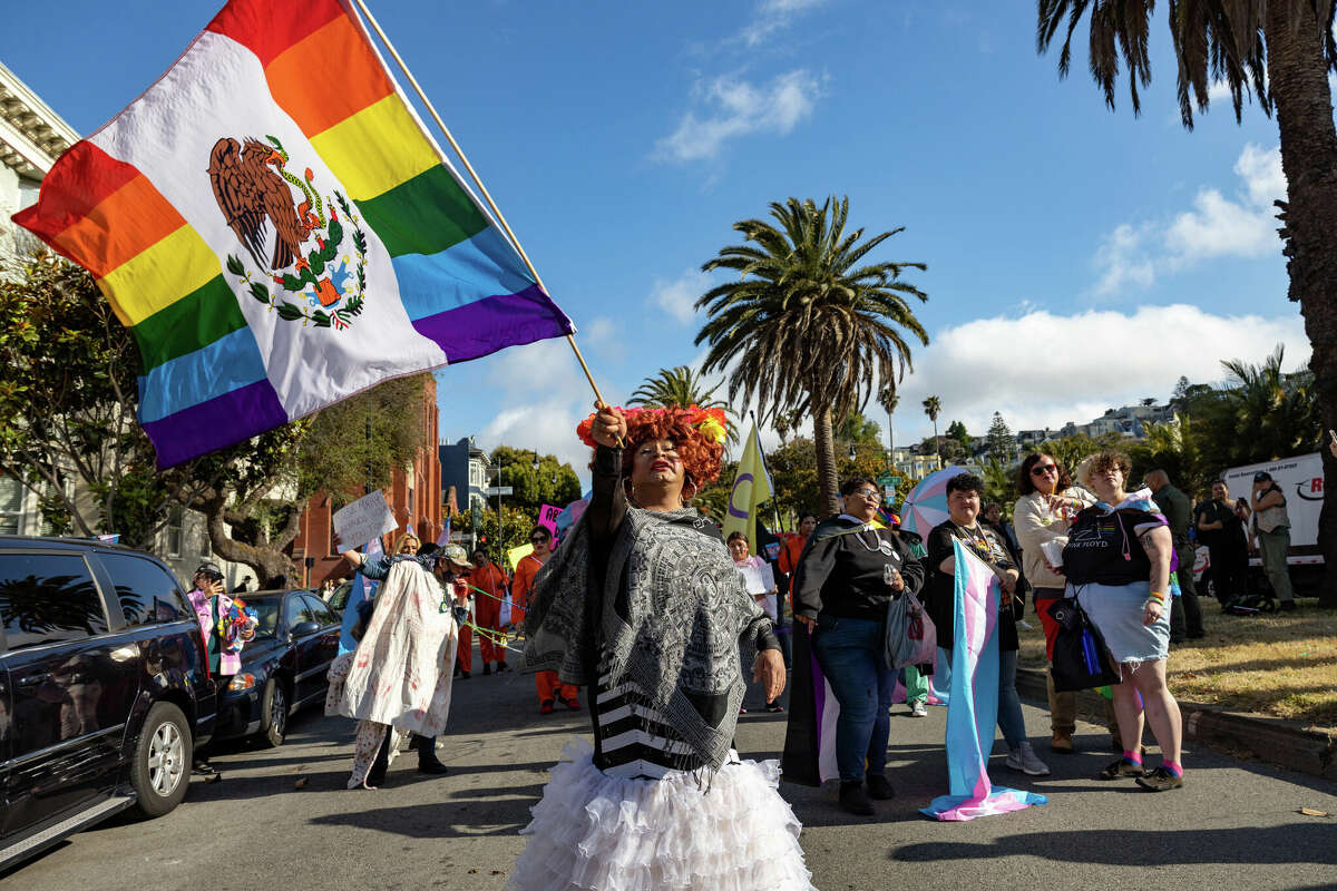 A participant waves a flag in the San Francisco Trans March on Friday, June 23.