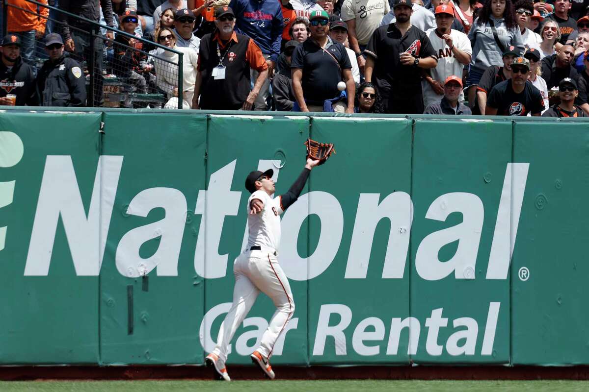 Brandon Belt played wearing a 'C' formed from electrical tape on