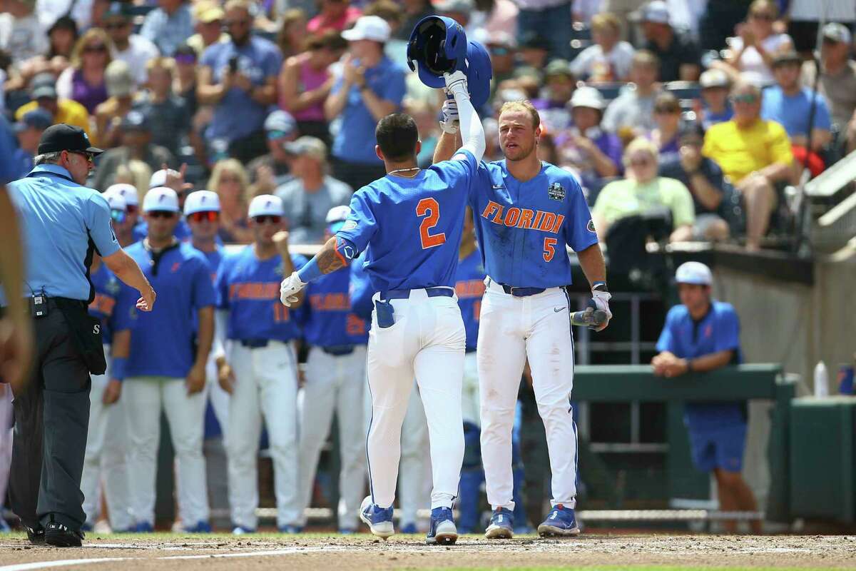 Florida infielder Josh Rivera (24) celebrates while running to