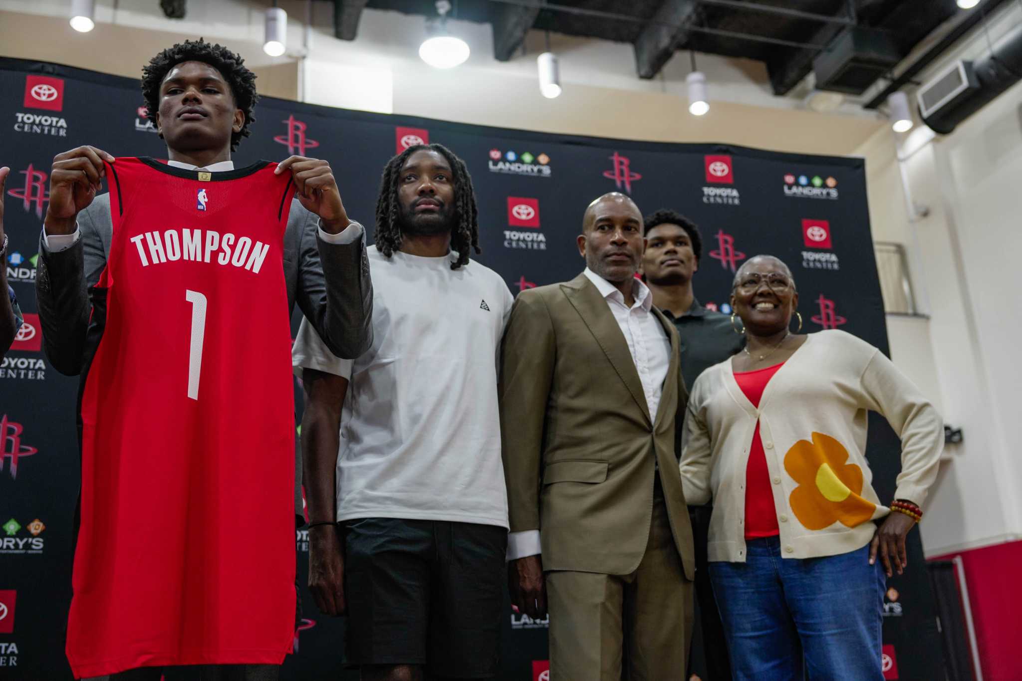 Houston Rockets NBA basketball first-round draft picks Cam Whitmore, left,  and Amen Thompson, right, hold up their jerseys during a news conference at  the Toyota Center in Houston, Monday, June 26, 2023. (