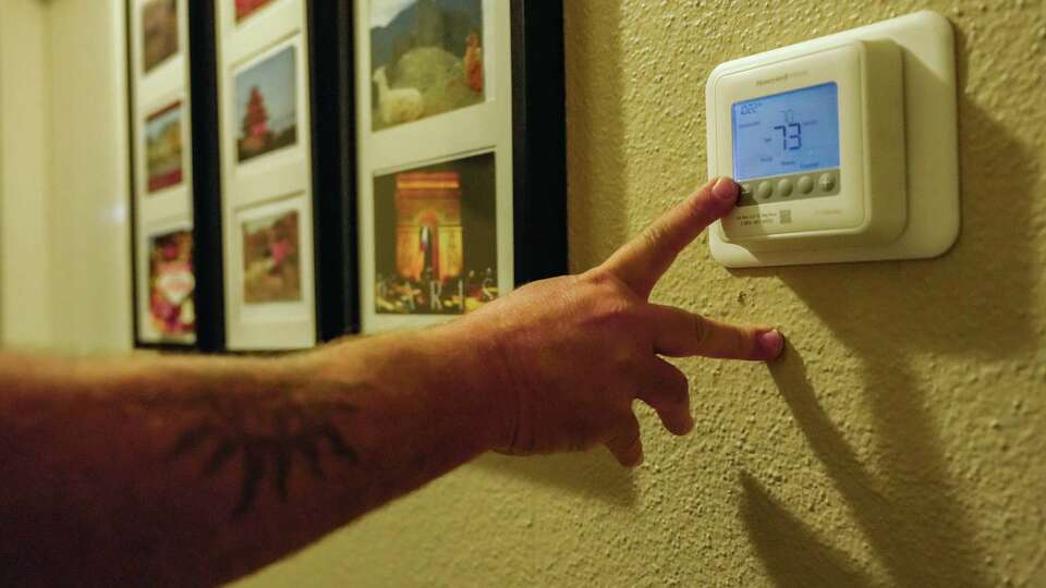 Ed Newby, owner of All Star A/C and Heating, fields calls during a heat wave on Monday, June 26, 2023 in Houston.