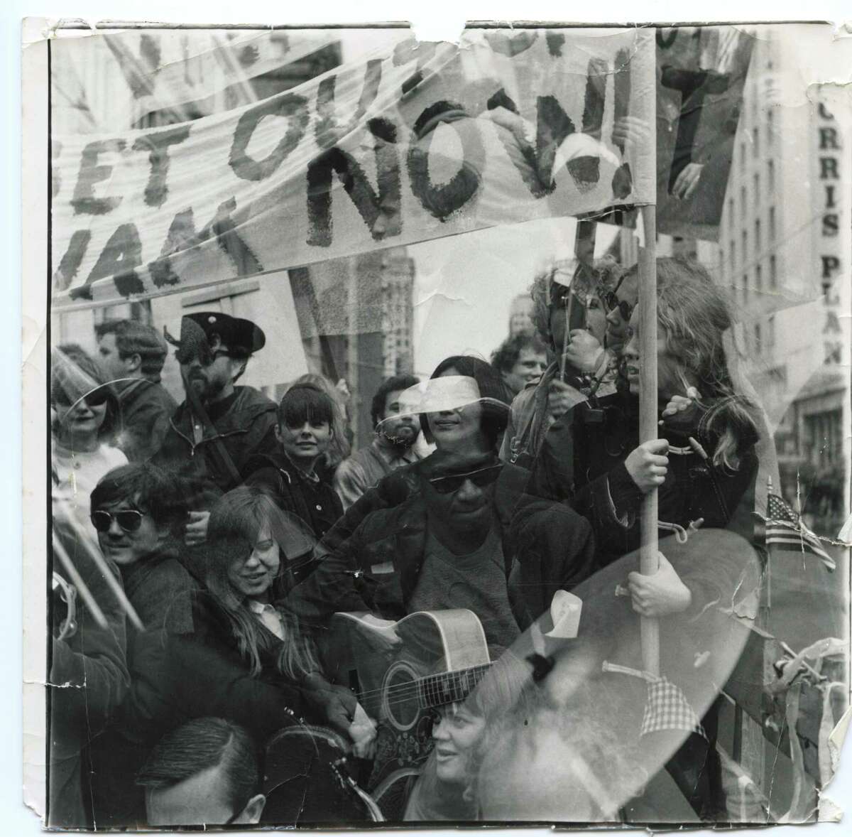 Mike Henderson with SFAI students and faculty on Wally Hedrick’s truck at a Vietnam war protest on Market Street in the late 1960s.