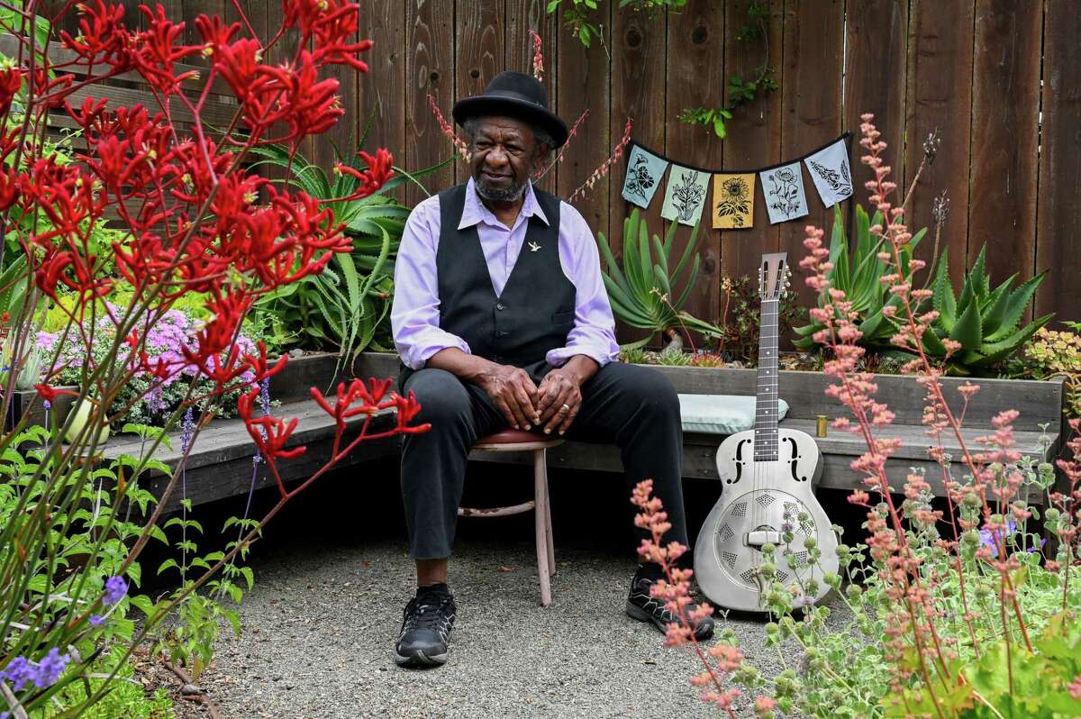 Mike Henderson pictured in his backyard garden in San Leandro.