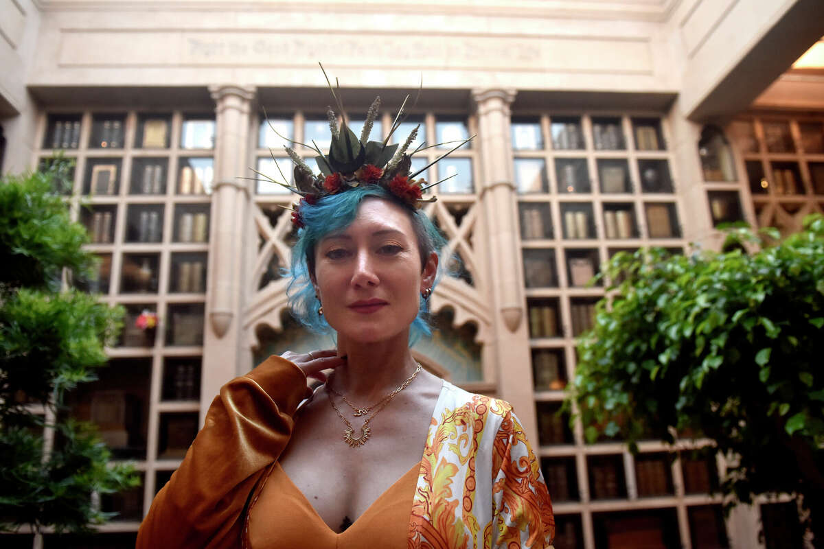 Summer Maddux, of Sacramento, is photographed inside the Chapel of the Chimes Funeral Home & Crematory, in Oakland, during the Garden of Memory musical event on the summer solstice, Wednesday June 21, 2023. 