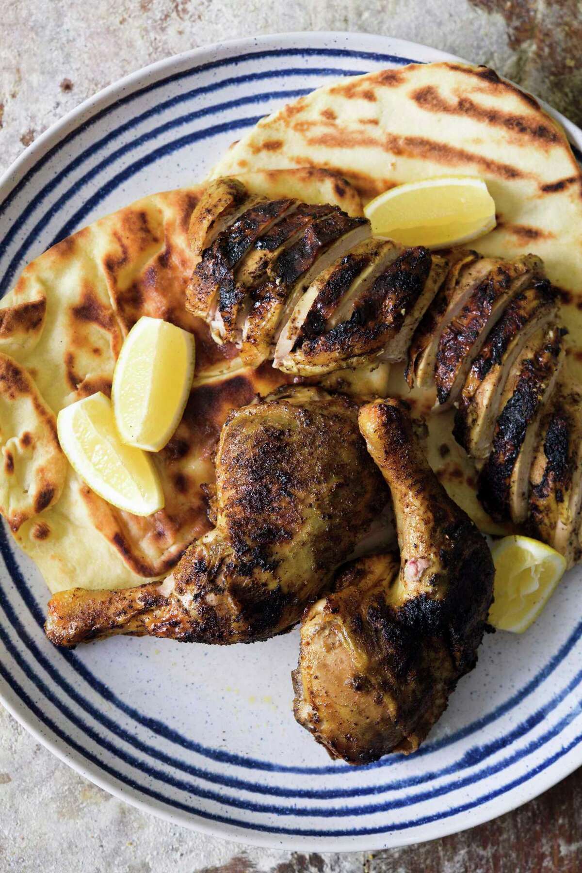 For barbecue season and July 4, grill a whole spiced chicken — without
