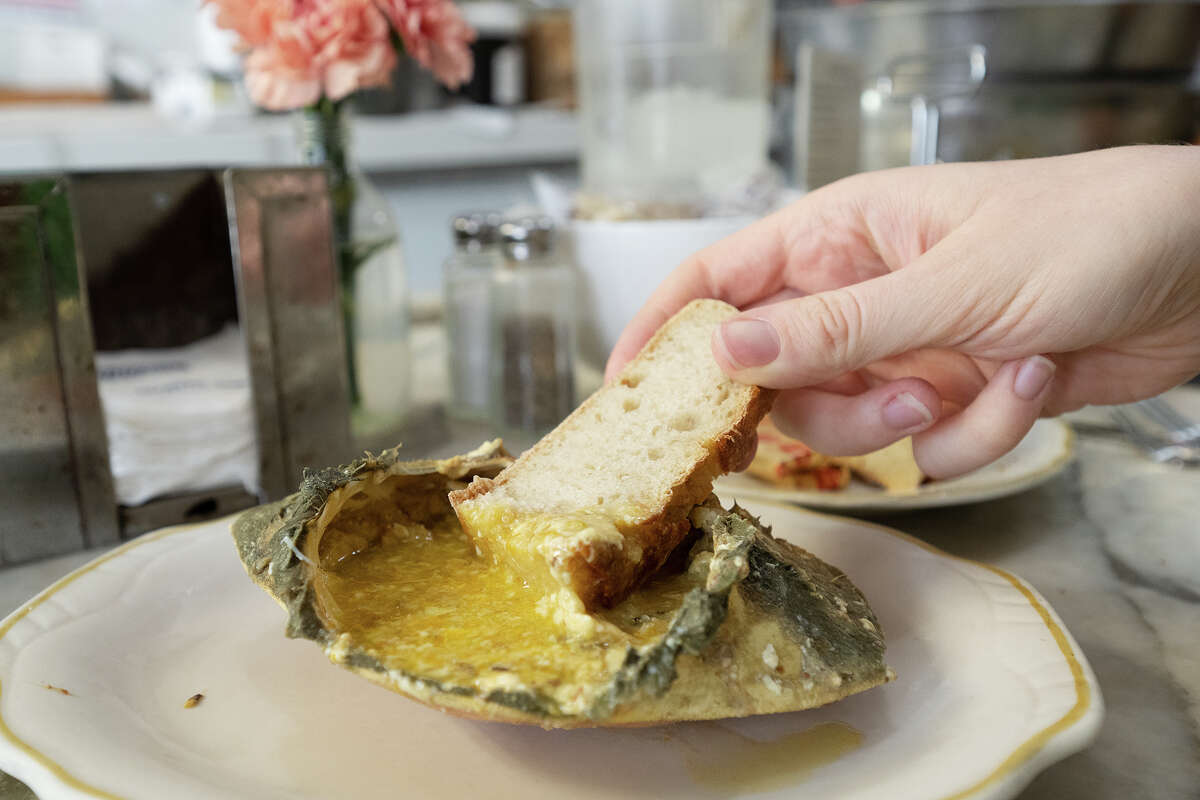 The crab back with sourdough bread at Swan Oyster Depot in San Francisco, June 27, 2023.