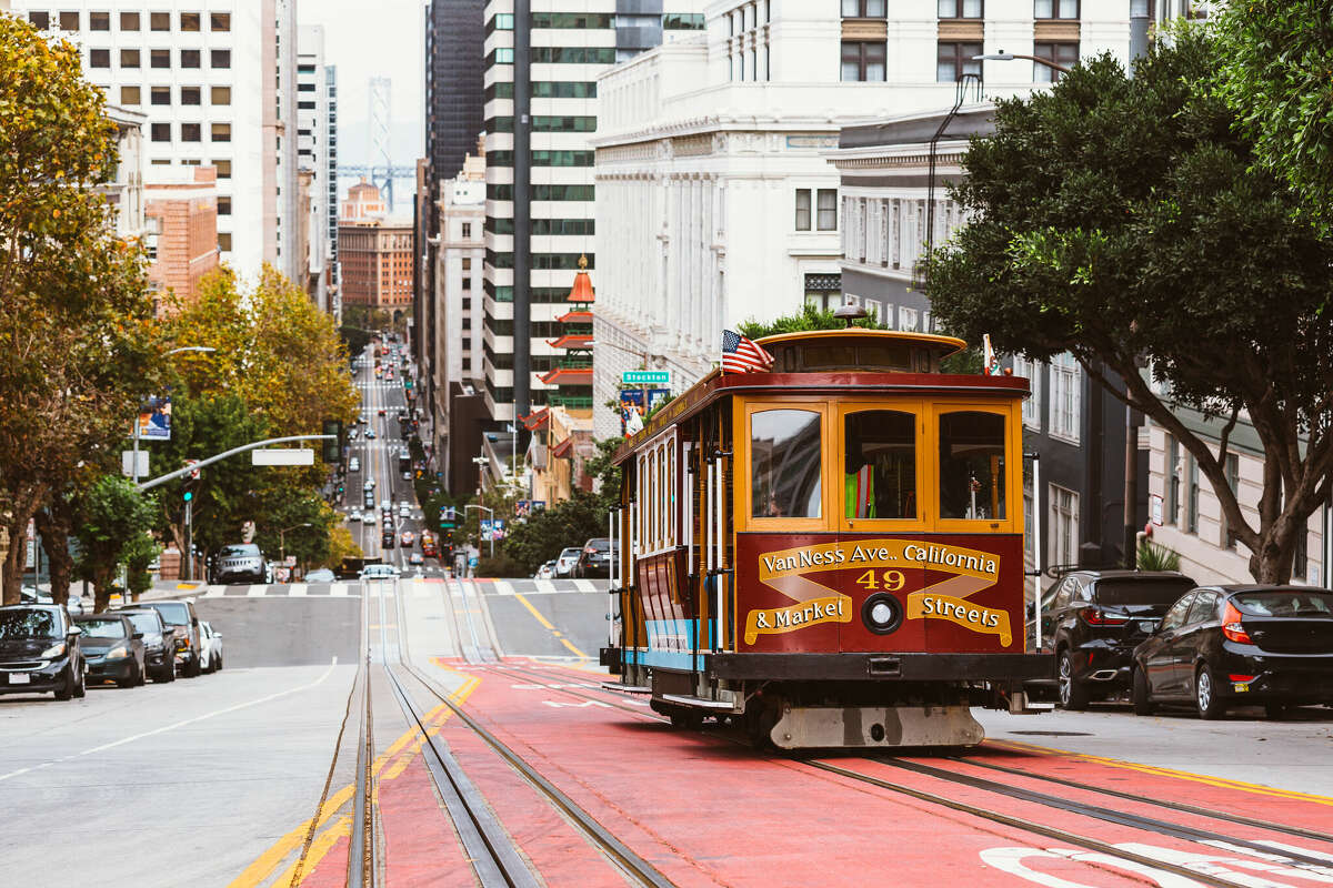 A street in San Francisco with historic cable car. 