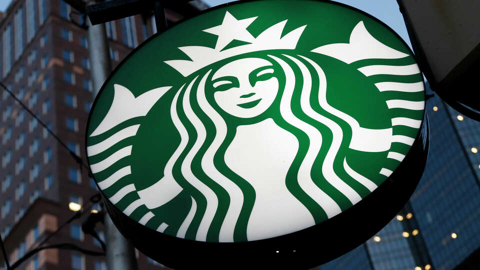 FILE - This file photo taken on June 26, 2019, shows a Starbucks sign outside a Starbucks coffee shop in downtown Pittsburgh, Pa. Starbucks is closing 16 stores around the country because of repeated safety issues, including drug use and other disruptive behaviors that threaten staff. The coffee giant said Tuesday, July 12, 2022, the closures are part of a larger effort to respond to staff concerns and make sure stores are safe and welcoming. (AP Photo/Gene J. Puskar, File)