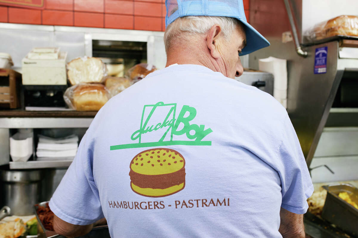 An employee works on orders at Lucky Boy in Pasadena, Calif., on Thursday.