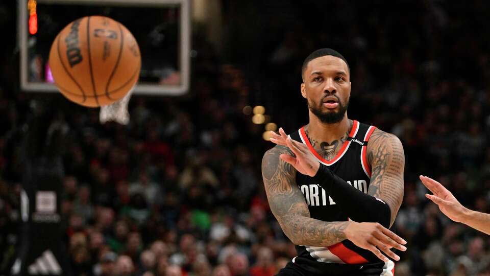 Damian Lillard (0) of the Portland Trail Blazers passes the ball during the second quarter against the Boston Celtics at the Moda Center on March 17, 2023, in Portland, Oregon.