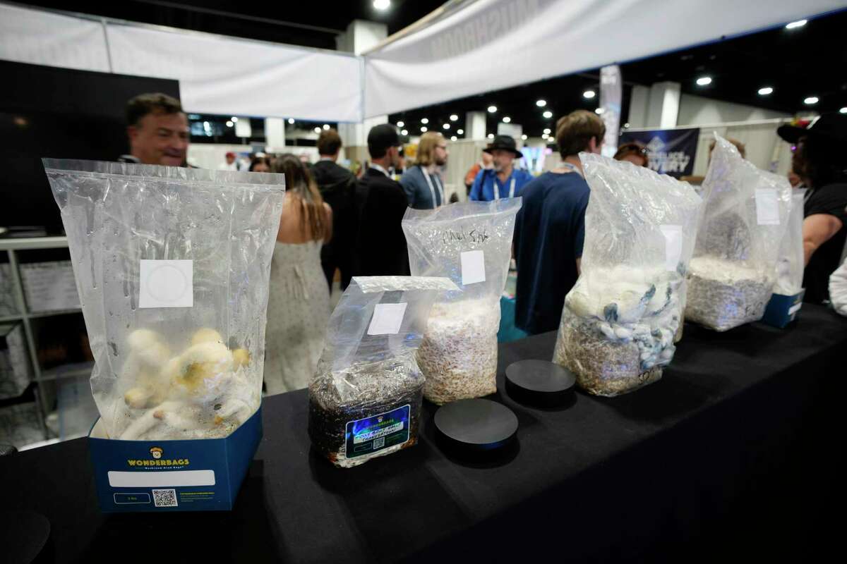 Exhibitors display their goods at the Psychedelic Science conference in the Colorado Convention Center Wednesday, June 21, 2023, in Denver. (AP Photo/David Zalubowski)