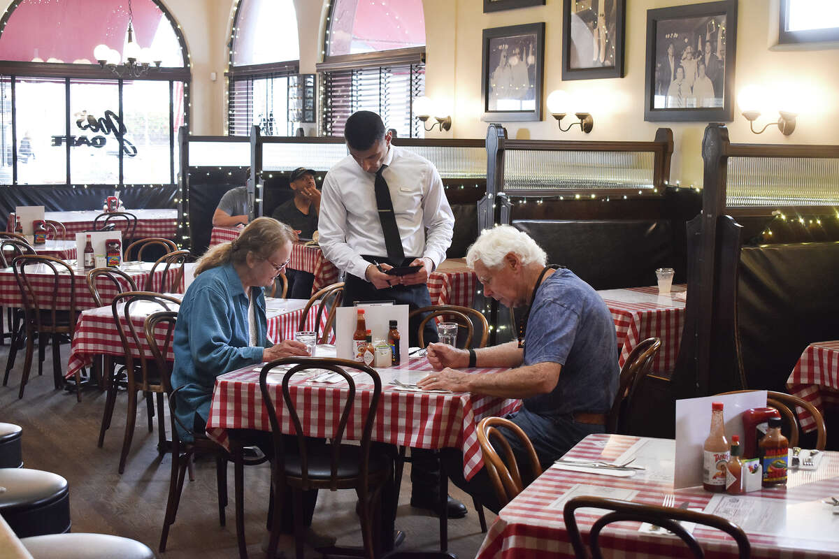 Two patrons place their order at Joe’s Cafe in Santa Barbara, Calif., on May 31, 2023. 