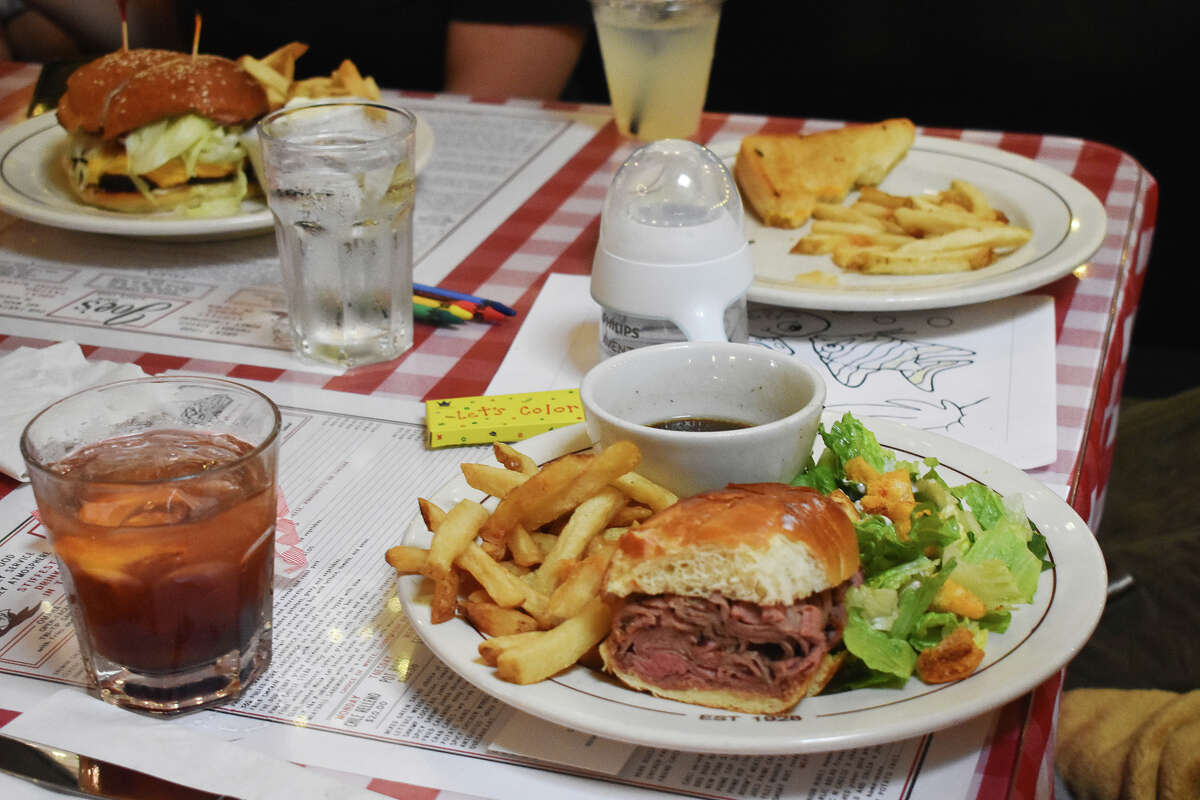 A family visiting from San Diego enjoys several offerings at Joe’s Cafe in Santa Barbara on May 31, 2023. 