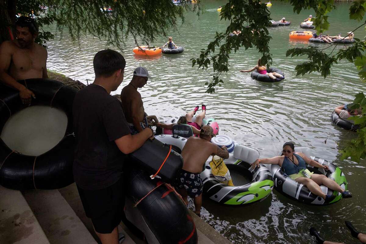 Photos Tubing along Guadalupe River on hot July day lures in Texans