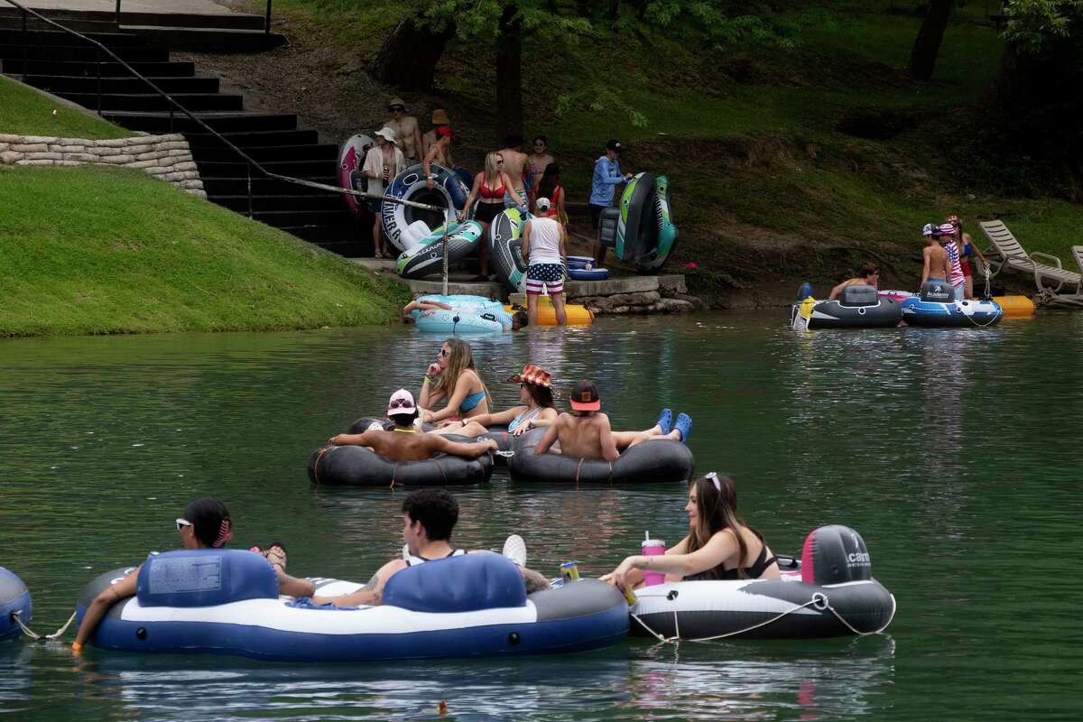 Photos Tubing along Guadalupe River on hot July day lures in Texans