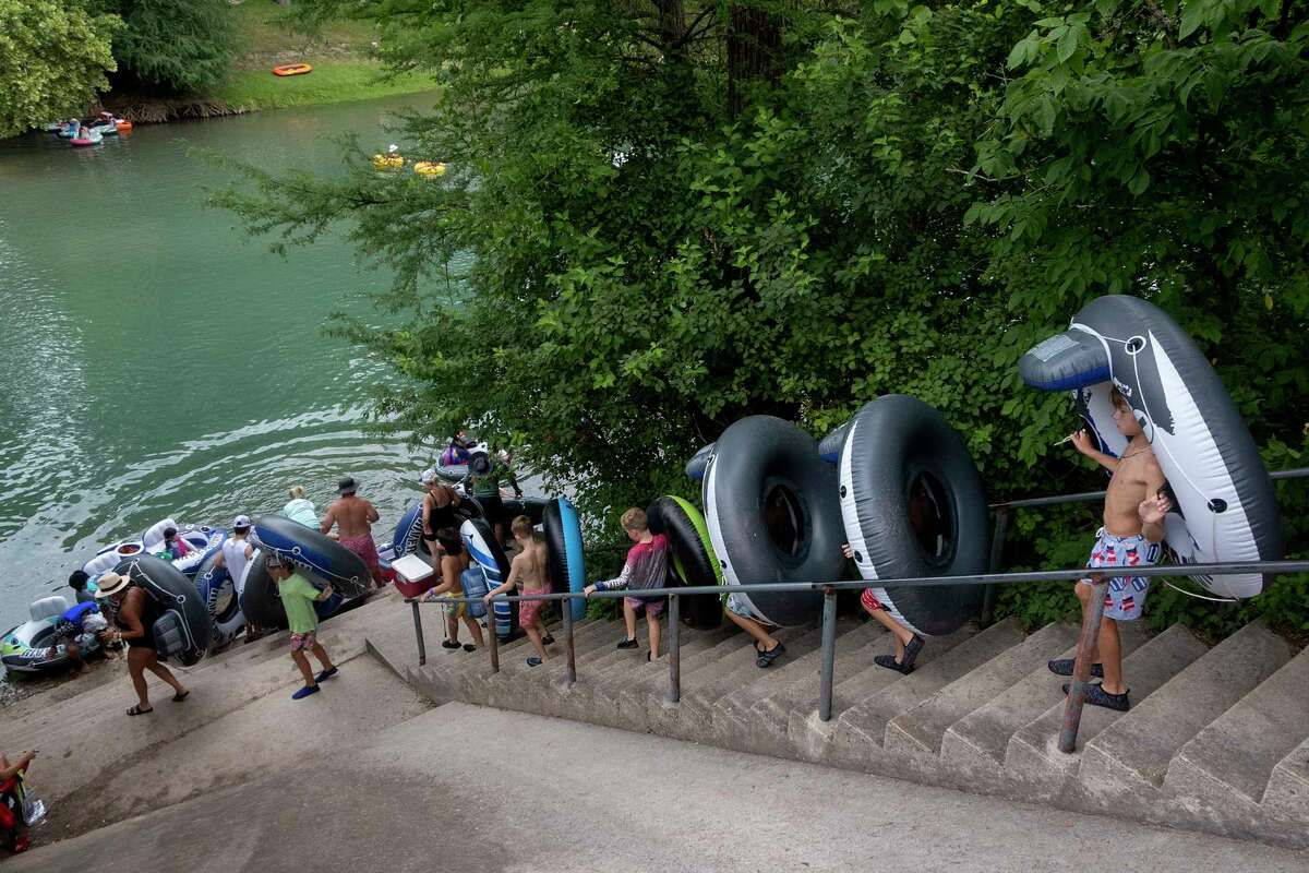 Photos Tubing along Guadalupe River on hot July day lures in Texans
