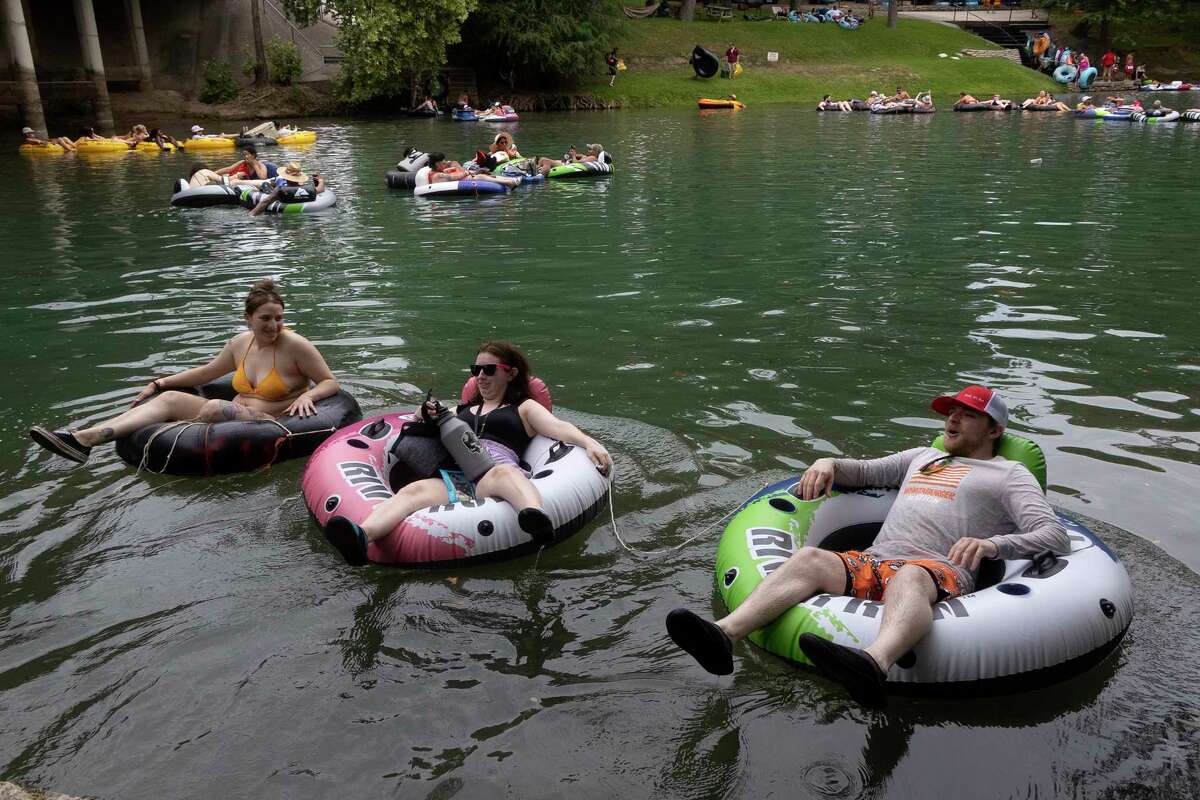 Photos Tubing along Guadalupe River on hot July day lures in Texans