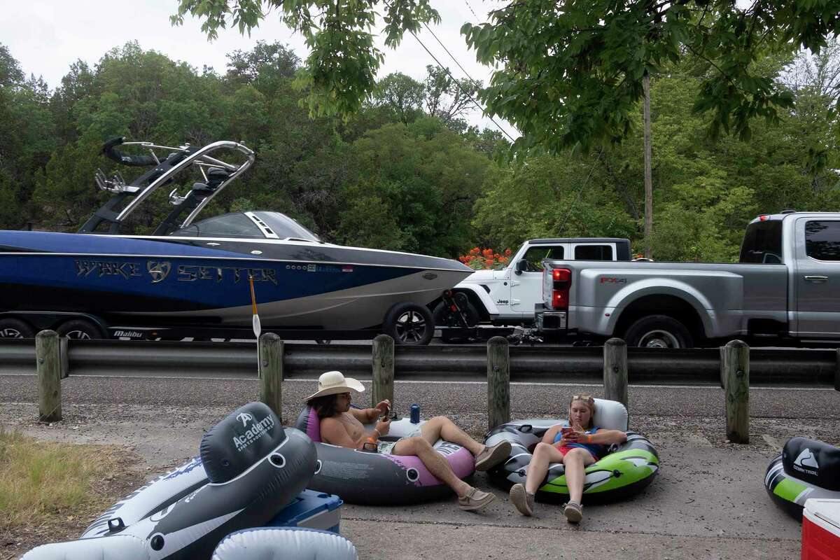 Photos Tubing along Guadalupe River on hot July day lures in Texans