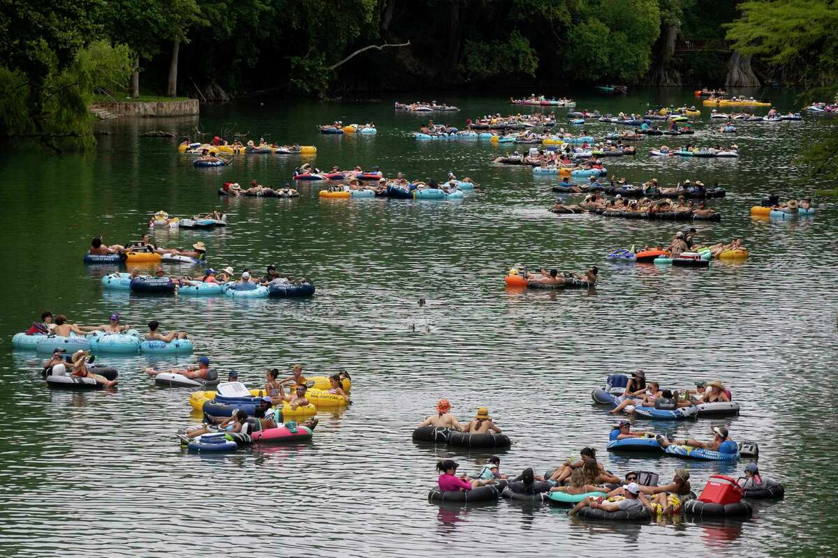 Photos Tubing along Guadalupe River on hot July day lures in Texans