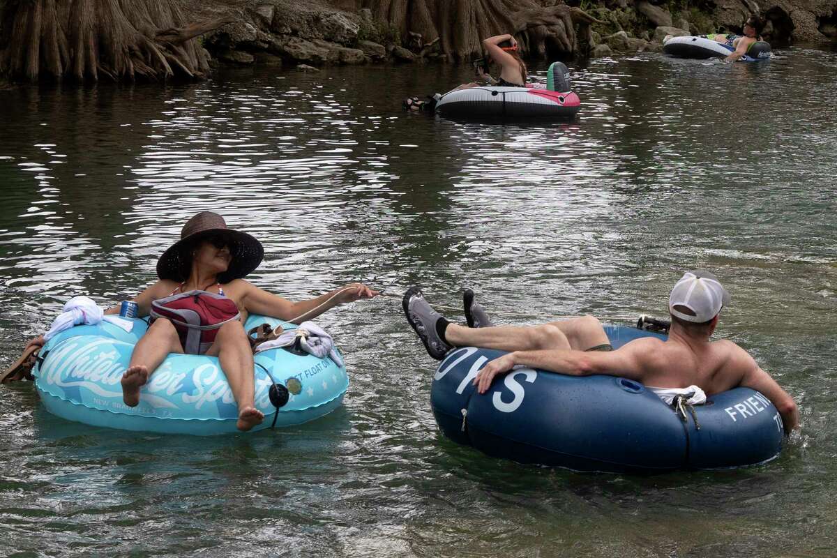 Photos Tubing along Guadalupe River on hot July day lures in Texans