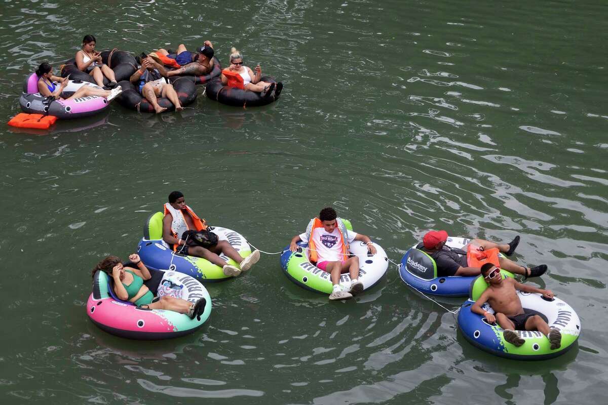 Photos Tubing along Guadalupe River on hot July day lures in Texans