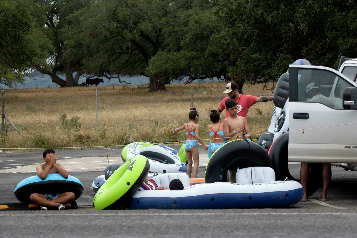 Photos Tubing along Guadalupe River on hot July day lures in Texans