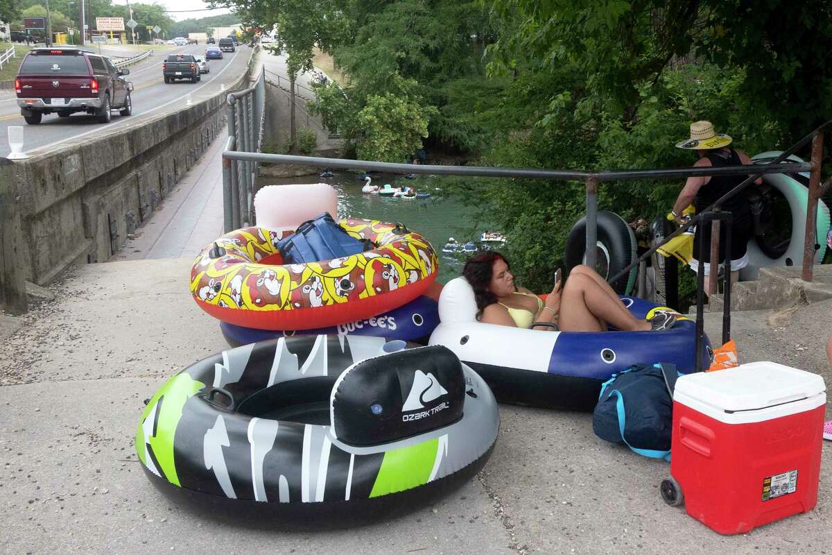 Photos Tubing along Guadalupe River on hot July day lures in Texans