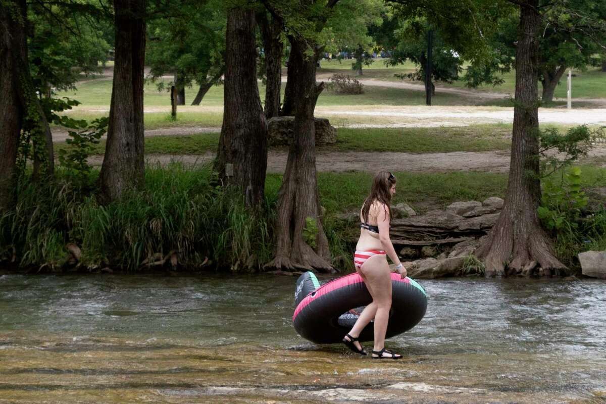 Photos Tubing along Guadalupe River on hot July day lures in Texans