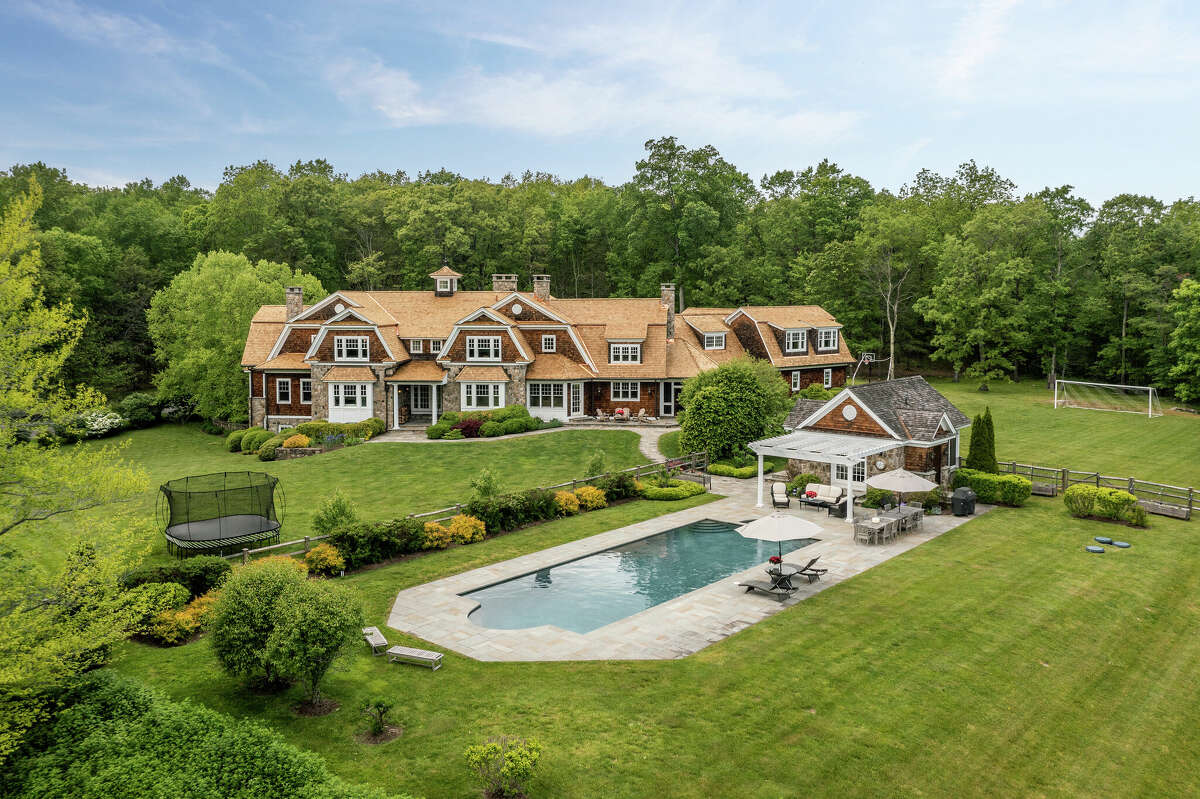 Roxbury hills home with 8car garage, lofted library listed for 3.3M