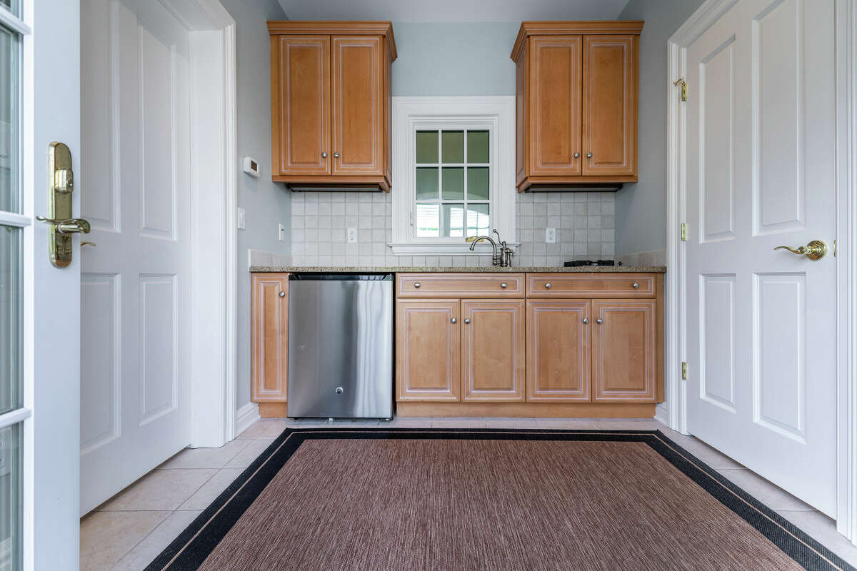 Roxbury hills home with 8car garage, lofted library listed for 3.3M