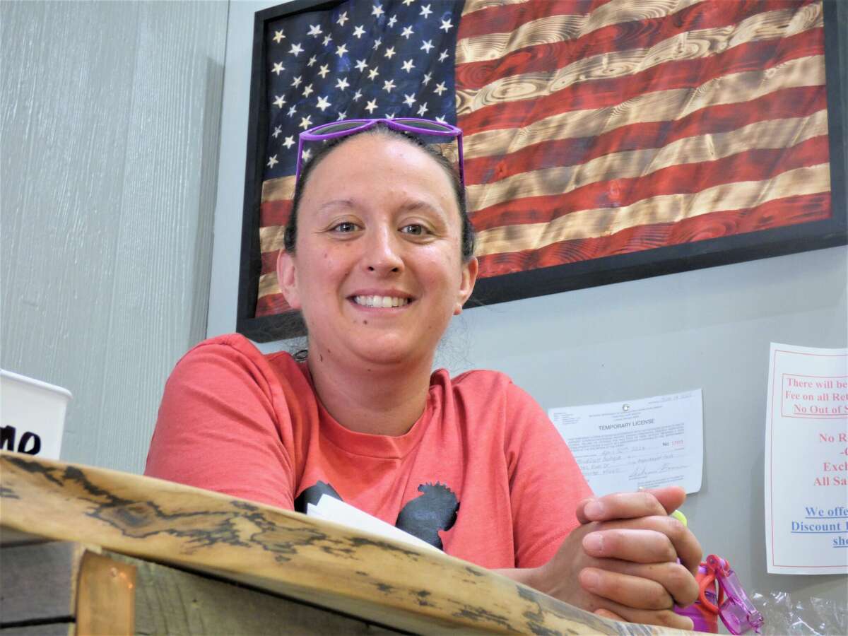 Stephanie Travis manages the counter at Third Coast Boutique. The shop recently moved to a new location on River Street. 