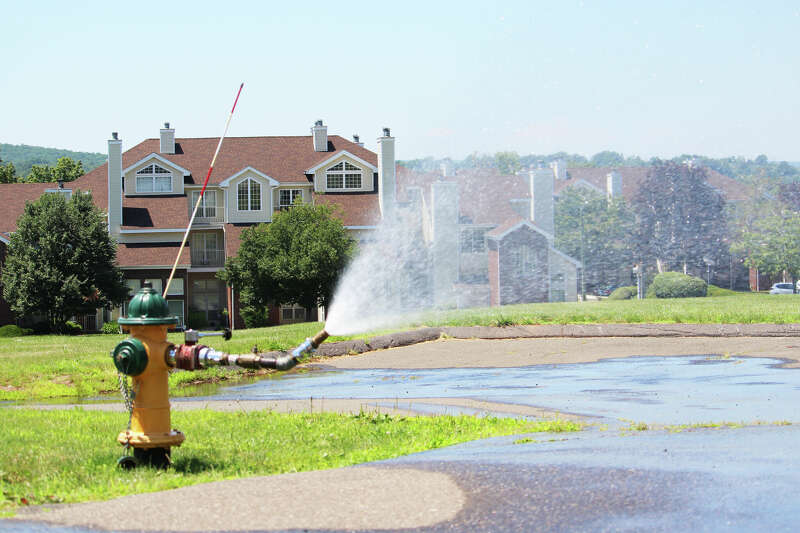 The Middletown Fire Department opened several fire hydrants at housing developments across the city in June 2021 to allow families to cool off during the heat wave. Shown here is the Highlands Crescent neighborhood.