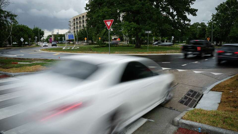 Traffic drives through the roundabout at the intersection of Washington Avenue and Westcott Street on Thursday, July 6, 2023, in Houston.