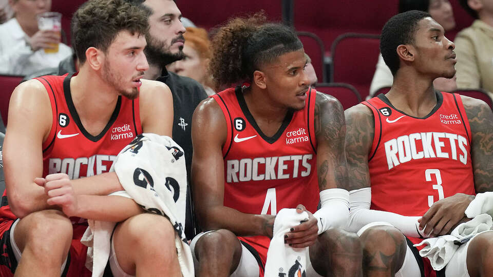 Houston Rockets center Alperen Sengun (28), from left, guards Jalen Green (4) and Kevin Porter Jr. (3) take a breather near the end of the first quarter against LA Clippers at the Toyota Center on Monday, Nov. 14, 2022 in Houston.