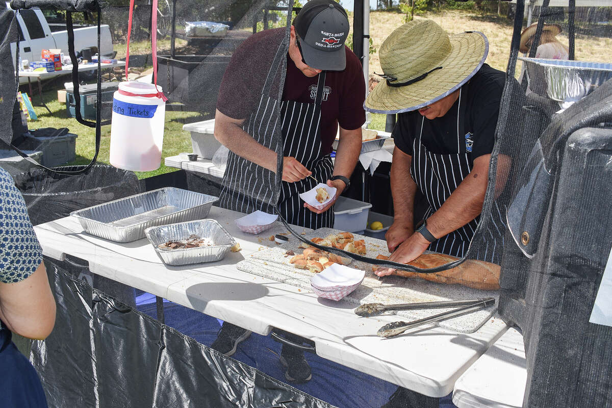 Cooks prepare Santa Maria-style barbecue at the Santa Maria Barbecue Festival on May 13, 2023. 