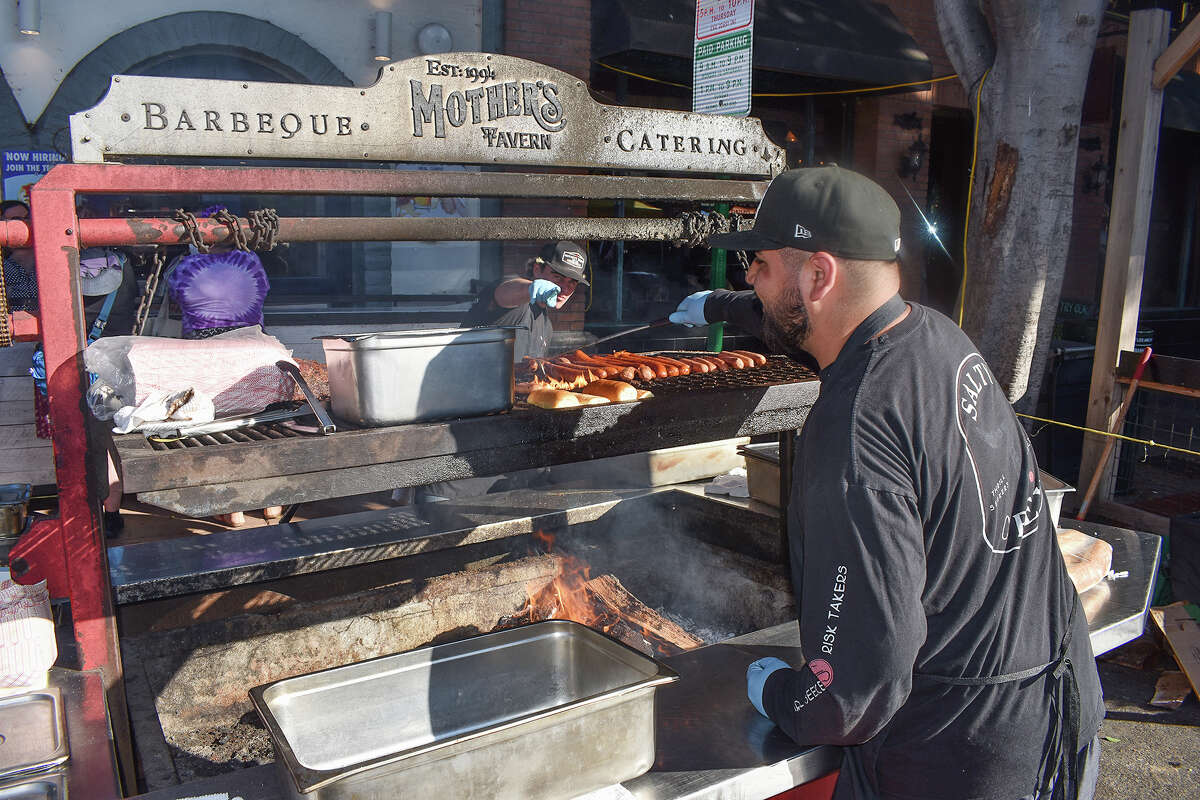 A cook in front of Mother's Tavern in San Luis Obispo prepare Santa Maria-style barbecue at the San Luis Obispo farmers' market on July 6, 2023. 