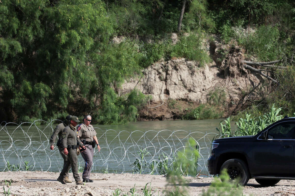 Texas Department of Public Safety personnel are seen in a closed off area of a public park by the Rio Grande in Eagle Pass, Texas, Monday, July 10, 2023.
