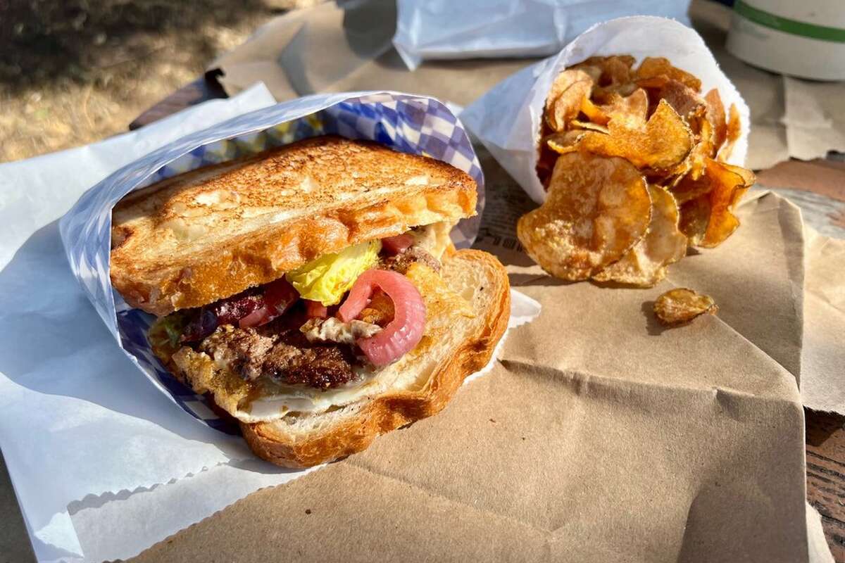 The burger sandwich and housemade chips featured at Dad's Lunchonette in Half Moon Bay. 