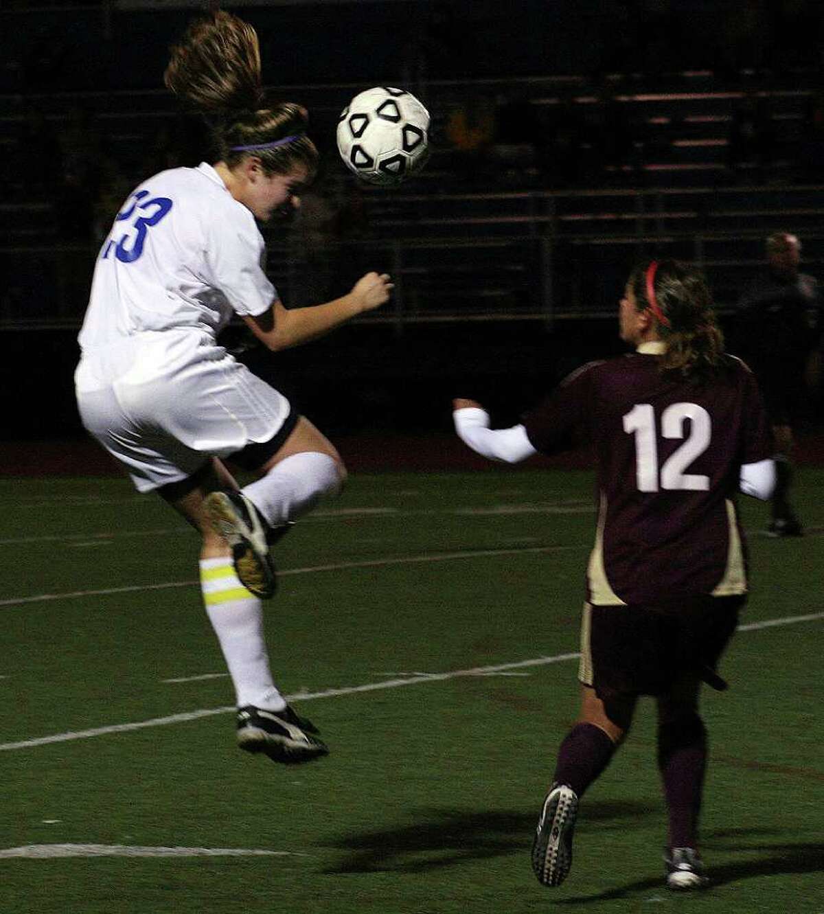 Fairfield Ludlowe midfielder Brooke Mackno (23) heads the ball in front of St. Joseph midfielder Silvia Yanez during a game on Wednesday, Oct. 20, 2010.
