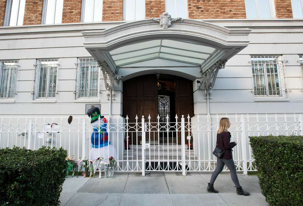 FILE: A woman walks passed the entrance to the Consulate-General of Russia building in San Francisco on Dec. 29, 2016.