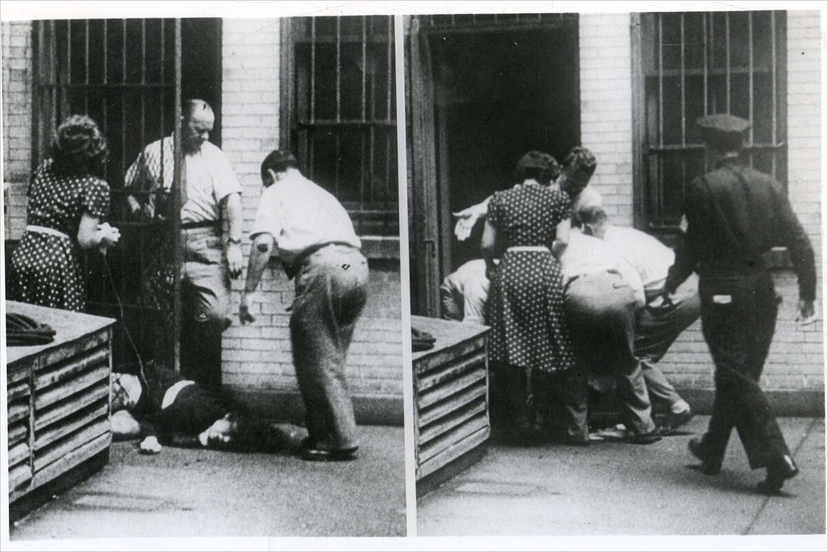 FILE: Oksana Kasenkina, a Soviet national, caused an international incident when she jumped from the third floor of the Soviet Embassy rather than be repatriated back to Russia, Aug. 12, 1948. In this photo, Kasenkina is being lifted and carried back into the consulate by embassy employees. 