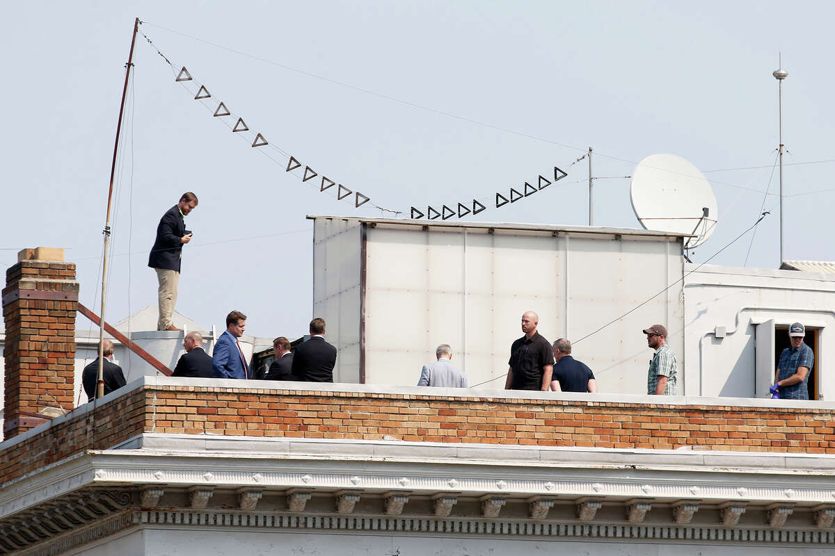 FILE: A group of men gather on the roof of the Russian consulate in San Francisco, Calif. 