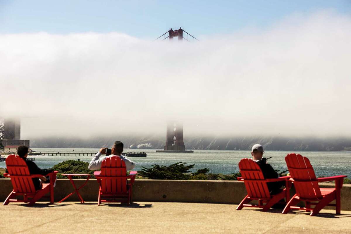 Visitors take in the view of San Francisco Bay from Presidio Tunnel Tops park.