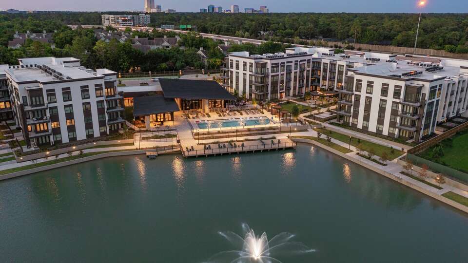 An aerial shot showing the 3-acre manmade lake already constructed outside the Remy On the Trails apartments in west Houston. 