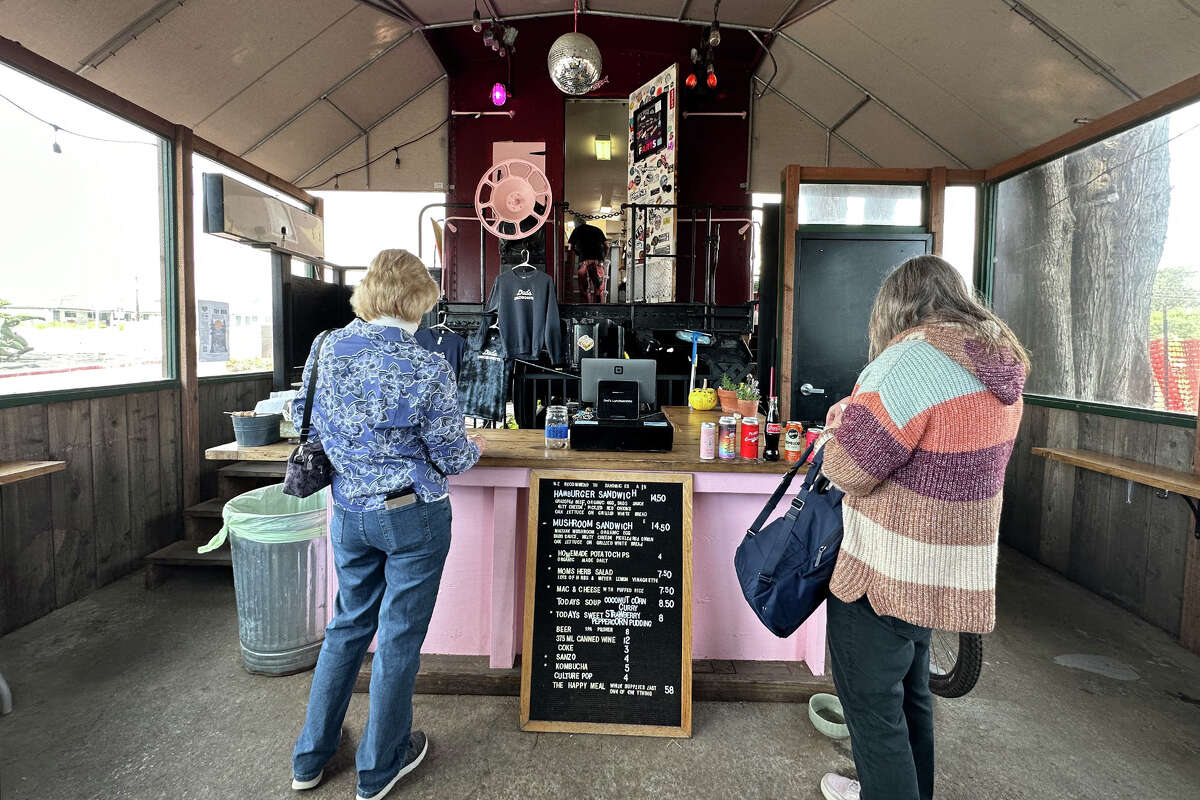 Customers glance at the menu inside Dad's Luncheonette. The restaurant is located inside a hundred year old caboose off Highway 1 in Half Moon Bay. 