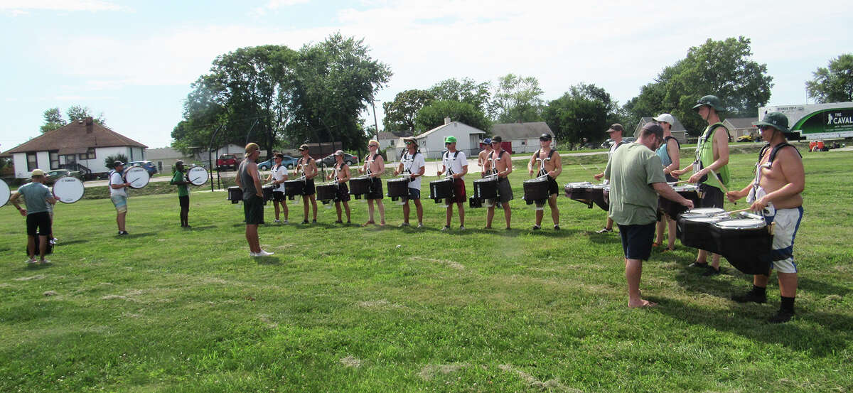 Cavaliers Drum & Bugle Corps march into Madison High School