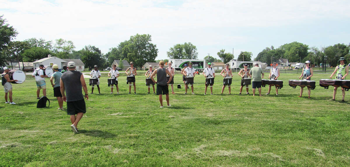 Cavaliers Drum & Bugle Corps march into Madison High School