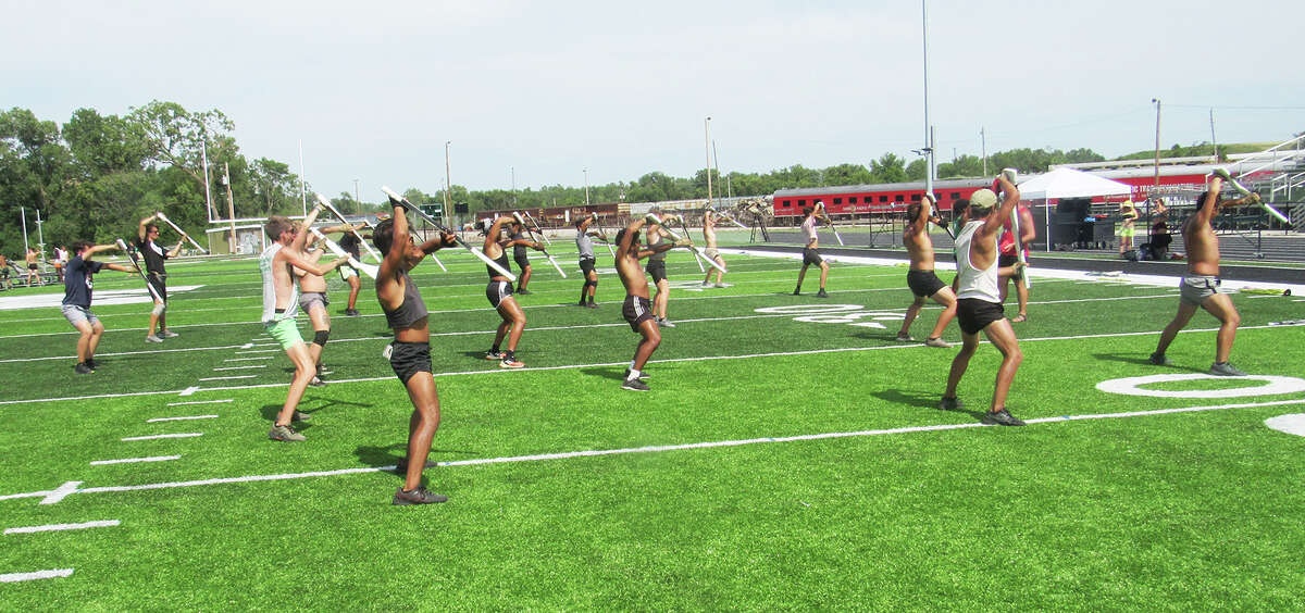 Cavaliers Drum & Bugle Corps march into Madison High School