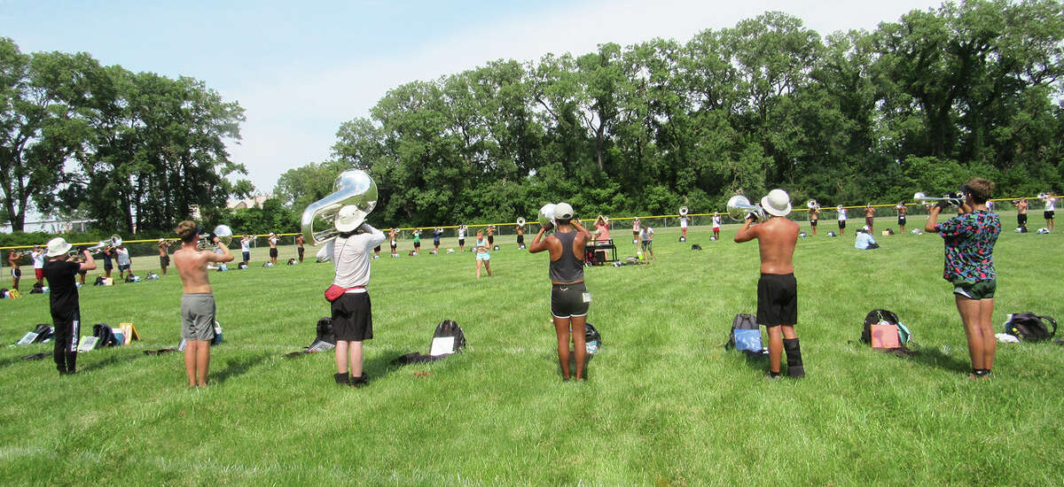 Cavaliers Drum & Bugle Corps march into Madison High School