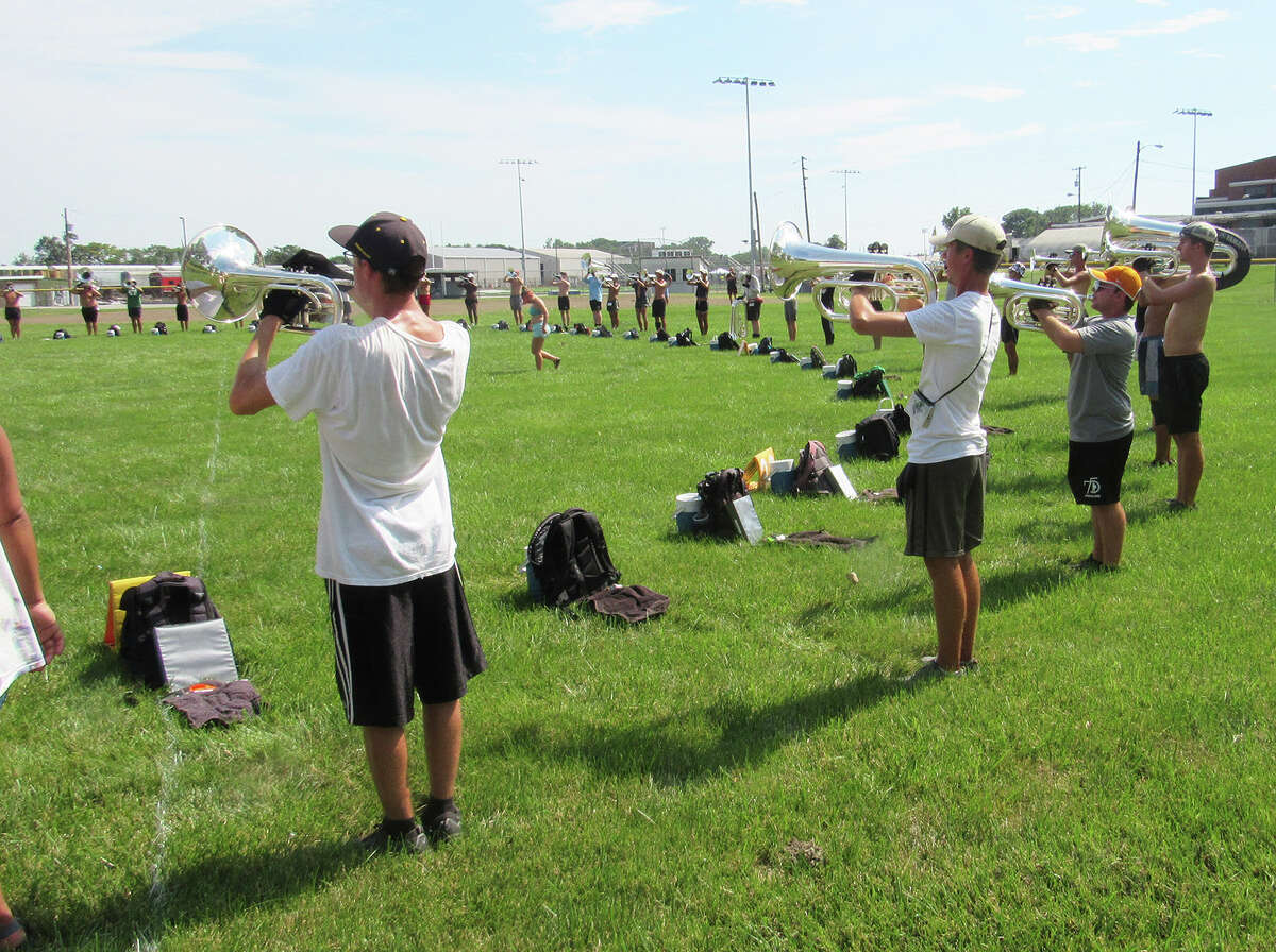 Cavaliers Drum & Bugle Corps march into Madison High School